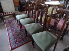 A Set of Four Edwardian Dining Chairs; the chairs being high back inlaid mahogany on turned and