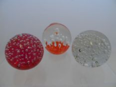 Four Glass Paperweights, various designs