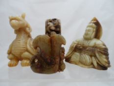 A collection of misc hard stone figures including Buddah, dragon, mythic figures and a miniature