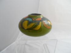 A Poole Pottery Vase - the vase being green abstract onion shaped, numbered 32 to base, initialled W