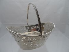 Solid Silver Miniature Fruit Basket; the fruit basket having pierced cross design with ribbed handle