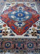 A Hand Woven Iranian Shahsavan Carpet, approx. 323 x 276 cms.