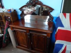 A Victorian Mahogany Chiffonier; the chiffonier having mirror back with scroll carving to top and