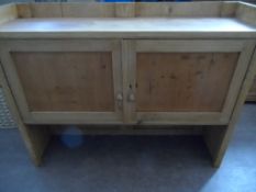 A Pine Dresser Top; having two cupboards, approx. 132 x 35 x 103 cms.