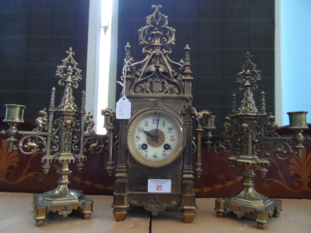 Edwardian Mantelpiece Clock Garniture, the brass gothic style garniture depicting dragons and