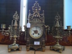 Edwardian Mantelpiece Clock Garniture, the brass gothic style garniture depicting dragons and