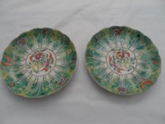 Late 19th century Famile Rose shaped Cabinet plates, the pair depicting fruit, insects and