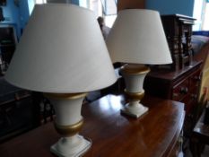 Laura Ashley A pair of cream pottery lamp bases and shades.