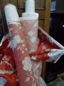 Two Part Rolls of Fabric the terracotta upholstery fabric featuring tree peony and birds.