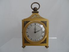 A Swiss Alarm Clock by Angelus in a brass case