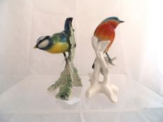 A Karl Ens figure of a Robin on a branch, approx. 15 cms high together with a Goebel Blue Tit on a