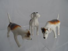 Three Beswick beagles.