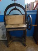 A Vintage Mangle by The South Birmingham Furn. Co. The mangle having wooden rollers and a cast