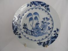 19th Century Plate painted blue in the Chinese style with a fenced garden and a rim having three