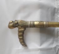 An Early 20th Century Brass Shafted Sword Stick, the handle being in the form of a sage