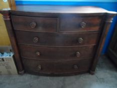 Bow Fronted Chest of Drawers with two short and three long drawers, shaped columns to either side on