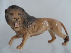 Beswick Porcelain Figure of a prowling lion, Beswick stamp to paw