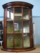 An antique bow fronted display cabinet being glass fronted, approx. 48 x 36 x 67 cms.