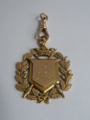 A 15ct Gold Medal inscribed 5th VBCRGC champion dated 1893 mm V & S, Birmingham hallmark, 625 marked