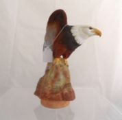 A possible Royal Worcester trial figure of a Bald Eagle, the eagle sitting on a rock, by E R