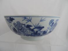 Circa 19th Blue and White Chinese Bowl depicting chrysanthemums to outer border and floral design to