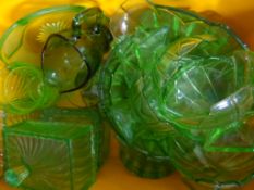 A large collection of green vintage Depression glass including jugs, bowls, lidded butter dishes,