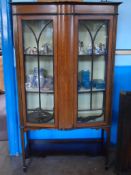 An Edwardian Inlaid Mahogany Display Cabinet, the cabinet having glazed front and sides on tapered