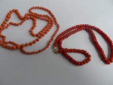 Two red Coral necklaces 86 and 44 cms in length respectively.