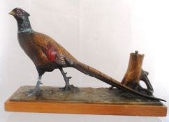 An Austrian cold painted Table Lighter, modelled as a standing pheasant, with a tree stump being the