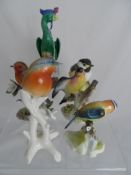 A collection of small bird figures to include Crown Staffordshire, Goebel, Royal Adderley etc. all