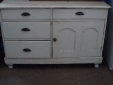 Antique white painted pine sideboard, features three graduated drawers to the left side and a drawer