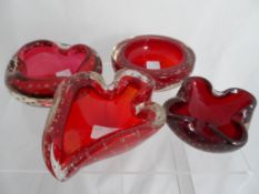 Four vintage Whitefriars Bubble bowls including three moulded Ruby bowls and one circular Ruby
