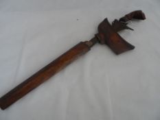 An antique Indonesian Bali Keris Dagger having a wave shaped damask blade with hand carved handle,