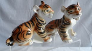 Two Porcelain Figures of Tiger Cubs, marked USSR to base
