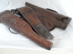 Three vintage brown leather gun cases, two are `leg of mutton` shaped and the other is sheep skin