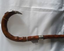 A Briar Walking Stick with wide silver strap band and large silver tip, hallmarked London 1888