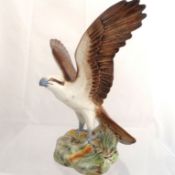 A Sylvac Figure of an Osprey, gripping a fish from the water, decorated in polychrome, approx. 21.