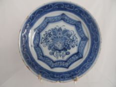 Circa 18th Century Blue and white Delft plate with central cartouche having fruit and flowers and