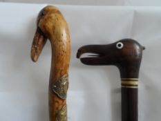 A Pair of Sticks having comical bird heads with glass eyes (2)