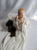 AN ARMAND MARSEILLE PORCELAIN HEADED DOLL STAMPED TO BACK OF NECK NUMBER 351/3K, THE DOLL HAVING