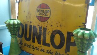 A LARGE DUNLOP BLACK AND YELLOW TYRE SIGN, APPROX. 122 X 91 cms