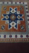 TWO PERSIAN STYLE WOOLLEN SQUARE VINTAGE CARPETS, APPROX. 150 X 150 cms AND 107 X 123 cms