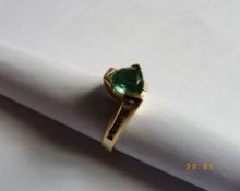 A 14 ct HALLMARKED LADY`S DIAMOND AND TOURMALINE RING. THE RING HAVING FIVE CHANNEL SET BRILLIANT