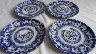 FOUR BLUE AND WHITE CIRCA 1900 ORIENTAL PORCELAIN PLATES DEPICTING CHARACTER IN A GARDEN - DOUBLE