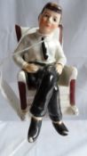 A VINTAGE SALT AND PEPPER IN THE FORM OF A SEATED PRESIDENT KENNEDY MARKED ARROW N.Y.C JAPAN DATED