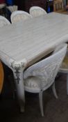 A LARGE CONTEMPORY MARBLE TOPPED CREAM DINING TABLE HAVING BRASS EMBELLISHMENTS AND REEDED