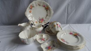 A PART CROWN DERBY TEA SET DECORATED WITH FLOWERS COMPRISING A SANDWICH PLATE, SIX SIDE PLATES,