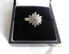 A 9 ct GOLD DIAMOND CLUSTER RING, SIZE K