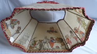 A VINTAGE LAMPSHADE ILLUSTRATED WITH CHARACTERS FROM `ALICE IN WONDERLAND` UNDERSTOOD TO BE GIVEN BY