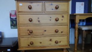 A MODERN PINE CHEST, HAVING TWO SHORT AND THREE LONG DRAWERS ON TURNED FEET, APPROX. 90 X 45 X 42